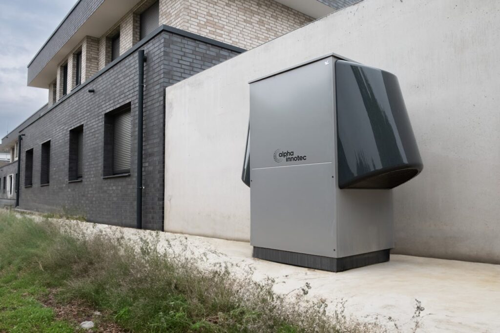 pexels-photo-20046691 Innovative heat pump system by alpha innotec installed outside a contemporary building.